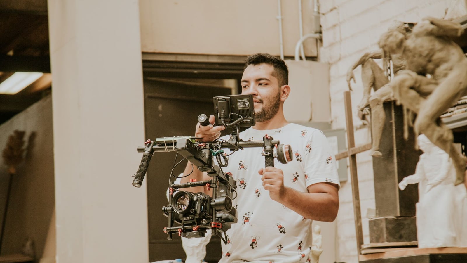A professional video production team collaborating in a bright, modern Melbourne studio with cinema equipment.