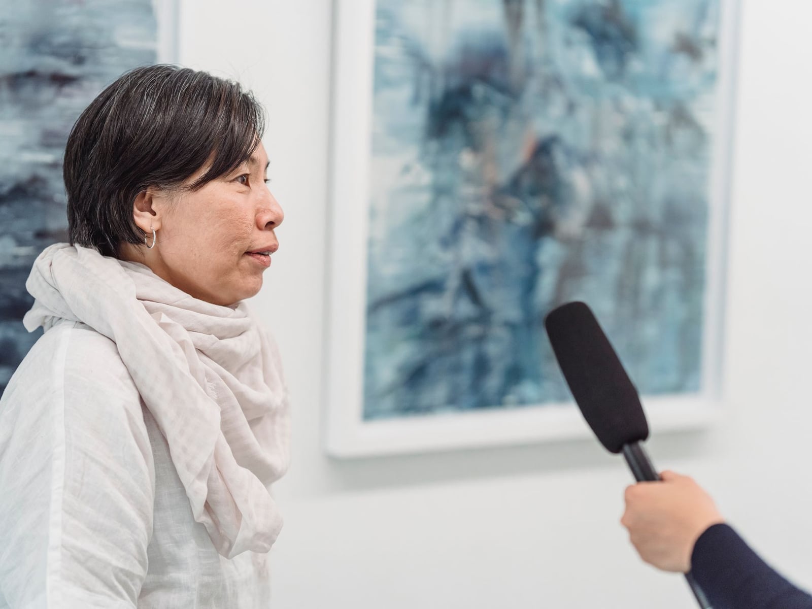 A professional interview session taking place in a white cyclorama studio in Melbourne.